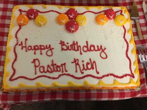 Photo of birthday cake with "Happy Birthday Pastor Rich" on the top