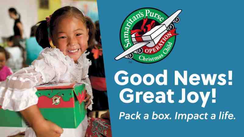 This is a promo photo for Operation Christmas Child pack a shoebox campaign. Features a happy young girl holding her Operation Christmas Child shoebox.